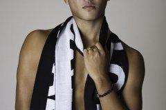 JOY_LEWIS_VERSACE_APPAREL_GUY_PULLING_VERSACE_SCARF
