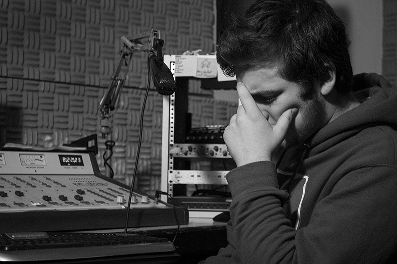 dj contemplating in studio