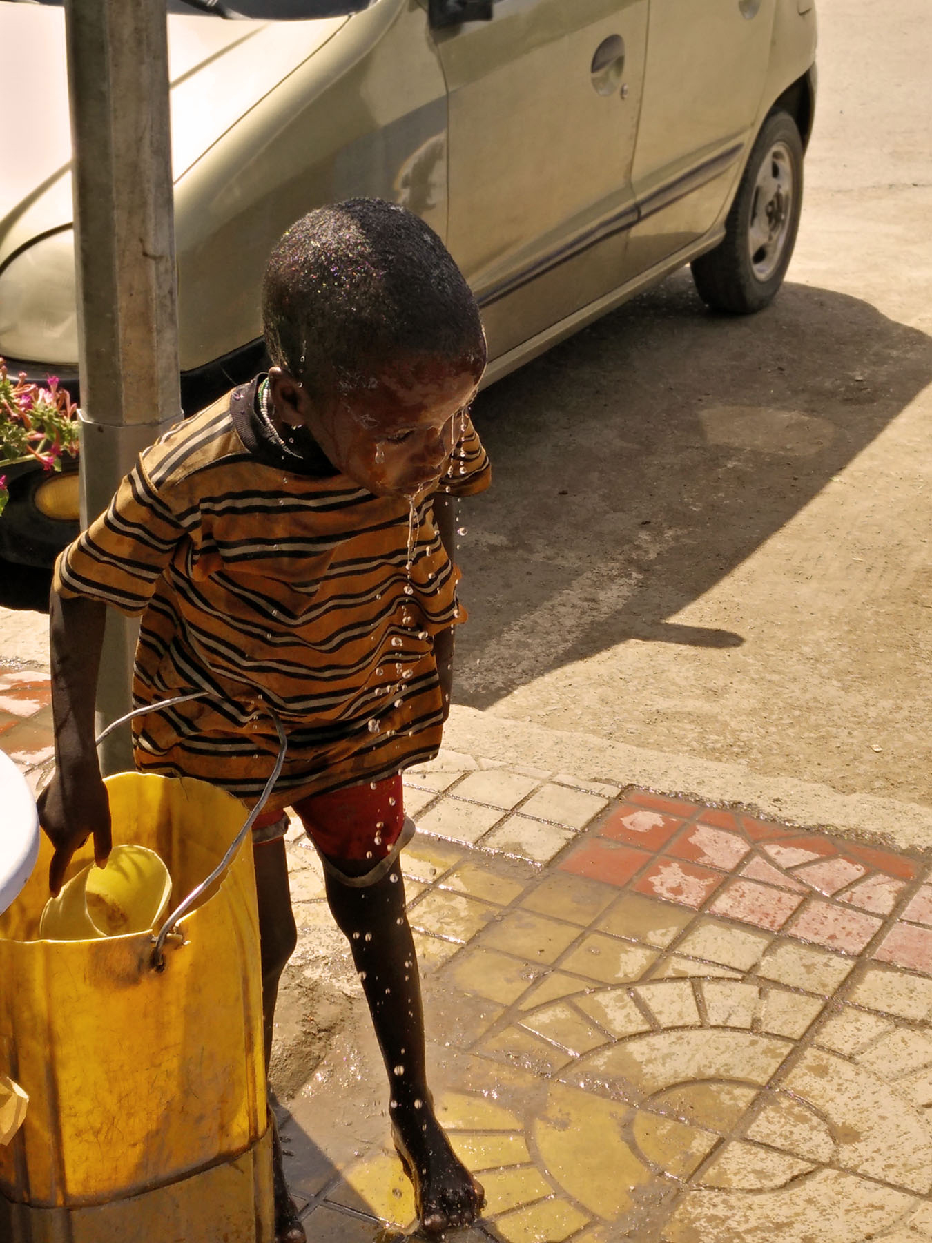 Anisha_Arora_photography_Ethiopian_Boy_bathing_shoes